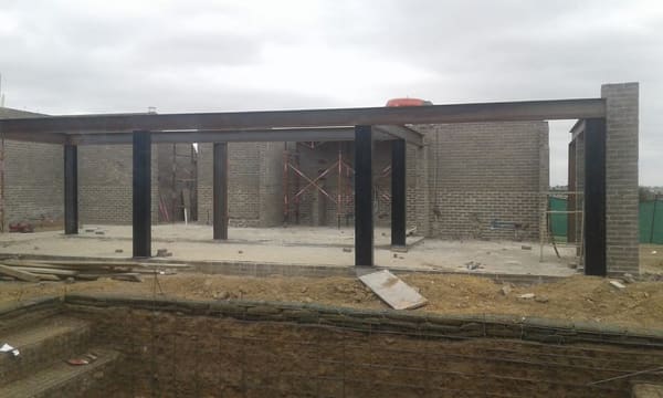 A steel I-beam structure, made and installed