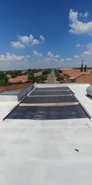 Solar heating panels for a pool, installed on a roof