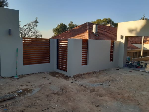 Boundary walls, panels and a gate